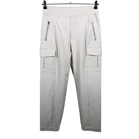 Unisex Athleta - Mittevenivad püksid, suurus 38 - Beige ()