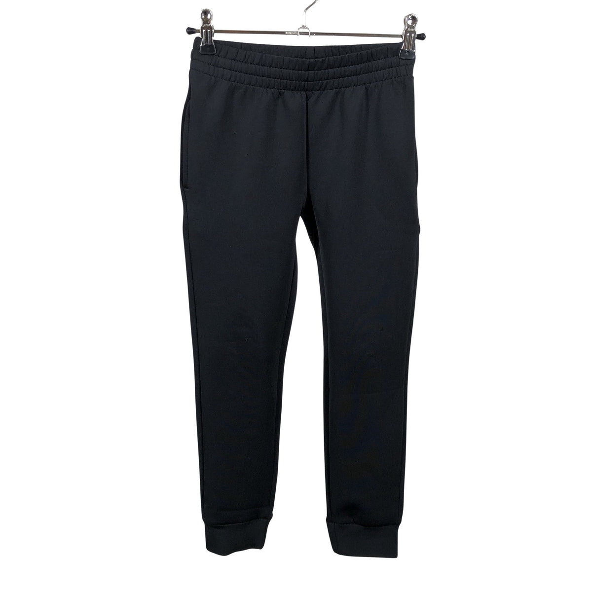 Unisex Reima - Trikotaažist püksid, suurus 116 - 122 - Must (1)