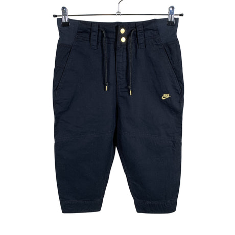Unisex Nike - Mittevenivad poolpikad püksid, suurus 34 - Must ()